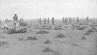 Australian infantrymen 
advancing towards the town of Tobruk