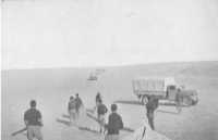 A convoy bringing supplies 
across the desert from Siwa to troops outside Giarabub