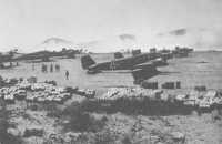 German transport planes and 
supplies on a Greek airfield, May 1941 (New Zealand War History Branch)