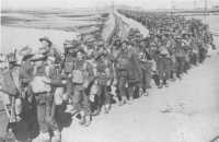 The 2/33rd Battalion 
leaving the transit camp at Suez to embark with other units of the 25th Brigade Group on USS Mount Vernon