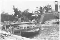A bomb-damaged ship in 
Tobruk Harbour