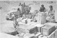 Loading stores and rations 
at a 9th Divisional AASC supply depot
