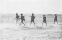 A section of Australian 
troops on the move at Tobruk