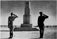 The salute after the 
ceremony at which General Morshead unveiled the memorial at the Tobruk War Cemetery