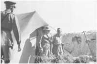 Mr Winston Churchill in 
jovial mood as he emerges from the mess tent at 9th Division tactical headquarters with General Morshead during his 
visit to the Western Desert, 5th August 1942