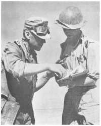 An Australian officer 
interrogating a German officer captured at El Alamein