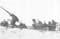German 88-mm gun and 
tractor destroyed in the Trig 29 area, El Alamein, by fire from `F` Troop, 2/7th Field Regiment, on 28th October 1942 
(Maj W