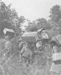 Native carriers climbing 
into the mountains south of Dagua with supplies for the forward troops of the 16th Brigade, 4th April 1945