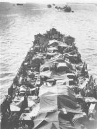 View from the mast of LST 
637 as she leaves Morotai on 27th April 1945 carrying troops of the 26th Brigade for the assault on Tarakan