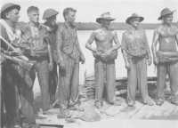 Some engineers of the 
2/13th Field Company on the pipeline jetty, Tarakan, on 30th April 1945 after having breached underwater obstacles in 
preparation for the assault