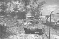 A Matilda tank advancing 
through Milikpapan port