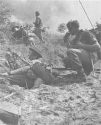 Directing mortar fire on to 
Hill 87, Balikpapan