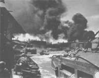 Troops of the 2/ 10th 
Battalion, supported by tanks, clearing the oil refinery area, Balikpapan