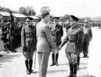 The King With Canadian 
Troops, July 1941 This photograph was taken on the occasion when H