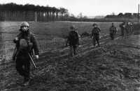 The Algonquins Moving Up, 
Men of The Algonquin Regiment moving forward in the Hochwald area, 1 March 1945, in preparation for the fierce struggle 
in the Gap the following day