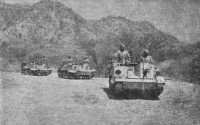 Bren-gun Carriers of 4/11 
Sikh coming into action around Keren