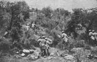 With bayonets fixed a 
platoon of Sikhs attack the enemy position up a mountain in Ethiopia