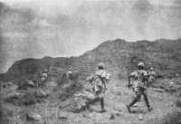 On the level top of the 
hill men rushing forward, during an attack on a mountain feature in Amba Alagi area