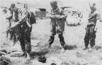 German Paratroops preparing 
to emplane on a Greek airfield