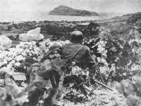 A German machine-gunner 
covers the advance