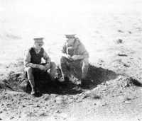 Two of the 
‘Commonwealth commanders’ confer in a shell hole: General Morshead (AIF), on the left, and General Freyberg