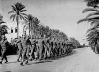 A New Zealand battalion 
approaches the saluting base on an Eighth Army church parade in Tripoli