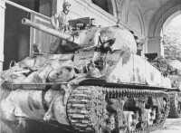 One of the first tanks to 
enter Rimini was this Sherman of 19 Armoured Regiment