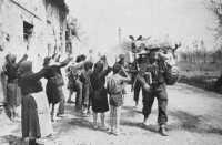 Italians who had stayed in 
Barbiano throughout the bombardment greet the New Zealanders as they pass through the village