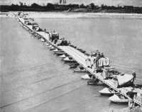 Artillery crossing the New 
Zealand Engineers’ folding-boat equipment bridge on the Po River