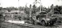 Malaria Control Unit 
spraying 37 NZ Field Park Company`s Camp, Guadalcanal