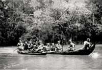 The carrier platoon of 35 
NZ Battalion crosses Timbala Bay in a native Canoe