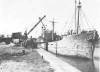 Coaster being unloaded at 
the minor port of Isigny on 24 June 1944 after coming up the canal from the Channel coast