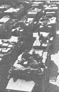 Trucks loaded with supplies 
waiting to be unloaded at Soissons, terminal of the Red Ball Express route serving First Army