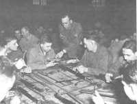Officer candidate class, 
Fontainebleau, performing detailed stripping of the M1 rifle