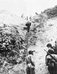 Rangers scaling the cliffs 
at Pointe du Hoc