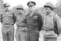 General Eisenhower with 
American field commanders (left to right) Generals Bradley, Gerow, and Collins