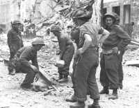 British Troops clearing 
away rubble in Caen, 9 July