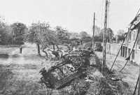 Wrecked German Armor 
bulldozed off a road near Roncey