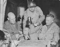 General Middleton confers 
with General Simpson (left) and General Stroh (right) near Brest