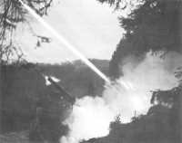 V Corps rocket launchers 
bombarding German positions