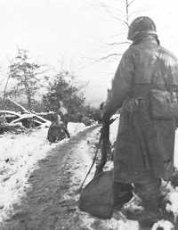 Men of the 331st Infantry 
advance on Gey