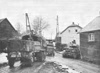 99th Division Vehicles 
Moving through Wirtzfeld en route to Elsenborn