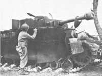 Wrecked German Tank showing 
“Bazooka Pants,” a Defense against Rockets