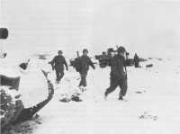 Paratroopers of the 101st 
Airborne Moving Up to Bastogne