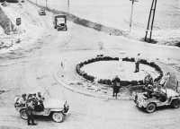 84th Division MP’S 
checking vehicles at traffic circle near Marche
