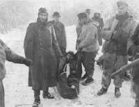 German Prisoners carrying 
one of their wounded in a blanket