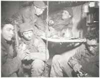 Men of the 4th Division 
eating inside captured pillbox