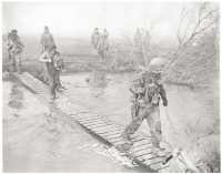 Footbridge across the Roer 
serves men of the 30th Division