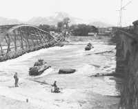 Tanks of the 20th Armored 
Division ford the Inn river en route to Salzburg