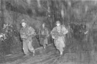 Company L, 142nd Regiment, 
36th Division, pulls back to rear in snowfall, near Langefosse, France, November 1944
